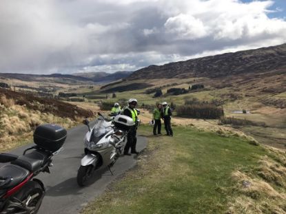 Motorcycles stopped for riders to view Glen Quaich